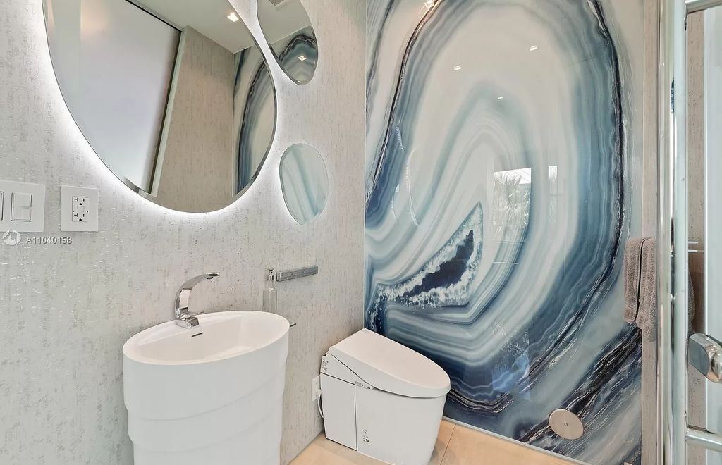The Home in Miami is a brand new luxury modern estate with stunning bay views and over 100 feet of linear waterfront now available for sale. This home located at 1133 Belle Meade Island Dr, Miami, Florida