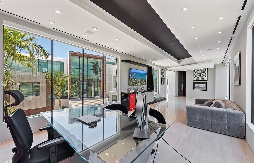 The Home in Miami is a brand new luxury modern estate with stunning bay views and over 100 feet of linear waterfront now available for sale. This home located at 1133 Belle Meade Island Dr, Miami, Florida