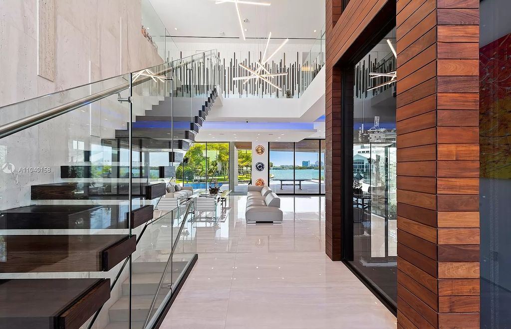 The Home in Miami is a brand new luxury modern estate with stunning bay views and over 100 feet of linear waterfront now available for sale. This home located at 1133 Belle Meade Island Dr, Miami, Florida