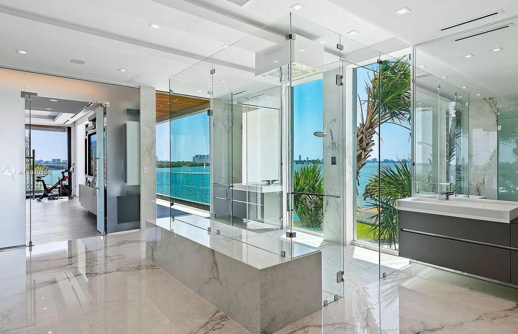 The Home in Miami is a brand new luxury modern estate with stunning bay views and over 100 feet of linear waterfront now available for sale. This home located at 1133 Belle Meade Island Dr, Miami, Florida