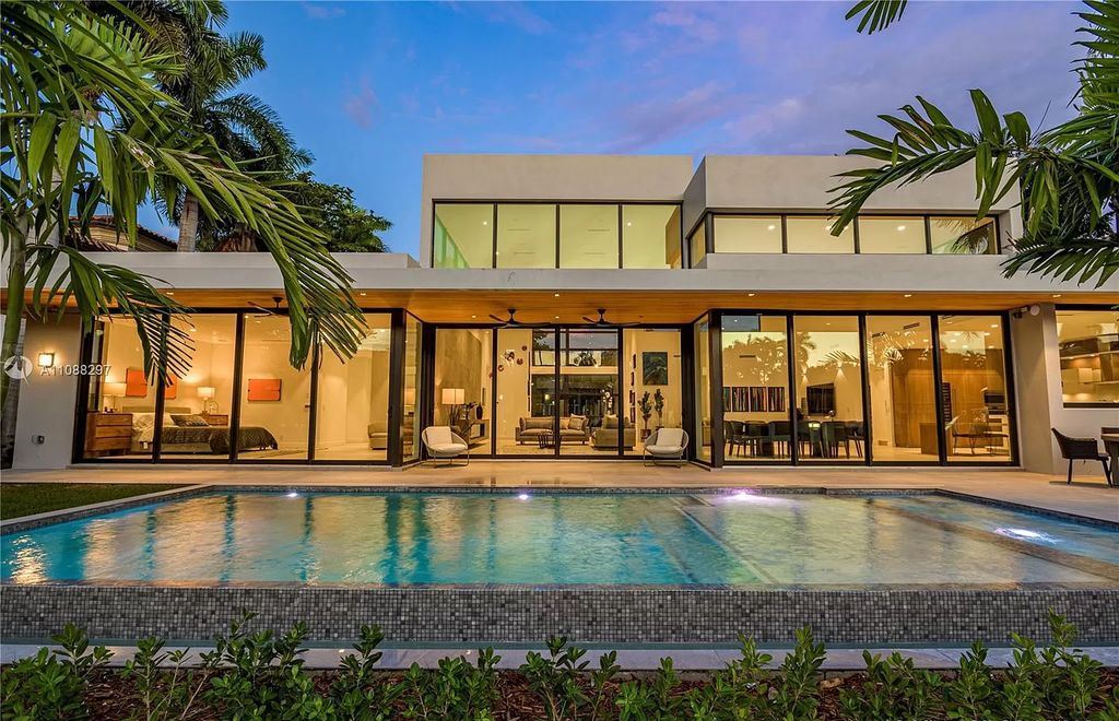 The Miami Home is a stunning brand new modern estate with enormous impact windows and doors offering an abundance of natural light now available for sale. This home located at 7362 SW 104th St, Miami, Florida
