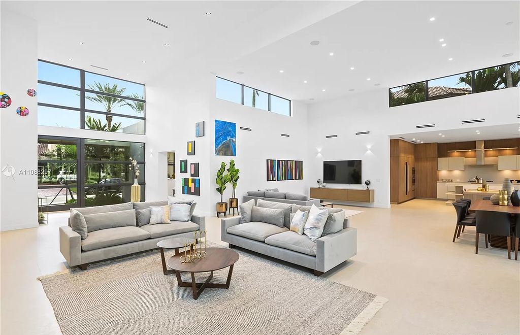 The Miami Home is a stunning brand new modern estate with enormous impact windows and doors offering an abundance of natural light now available for sale. This home located at 7362 SW 104th St, Miami, Florida