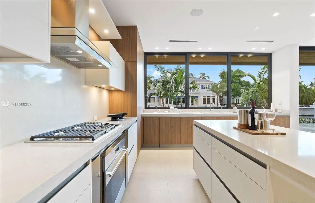 The Miami Home is a stunning brand new modern estate with enormous impact windows and doors offering an abundance of natural light now available for sale. This home located at 7362 SW 104th St, Miami, Florida