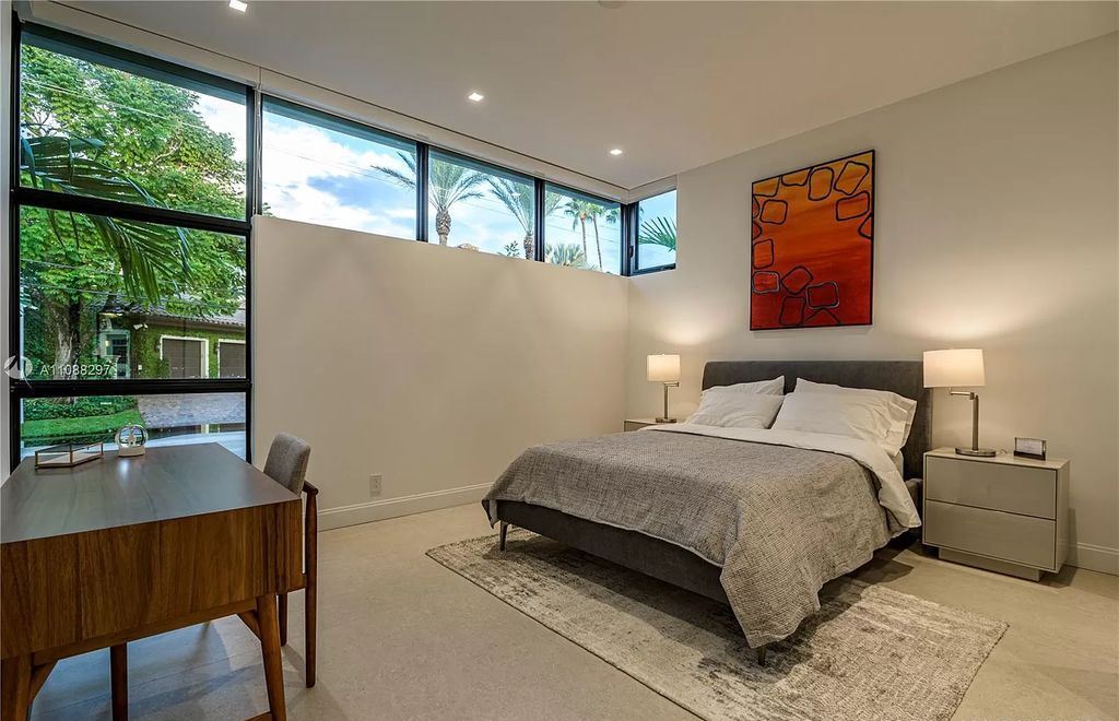 The Miami Home is a stunning brand new modern estate with enormous impact windows and doors offering an abundance of natural light now available for sale. This home located at 7362 SW 104th St, Miami, Florida