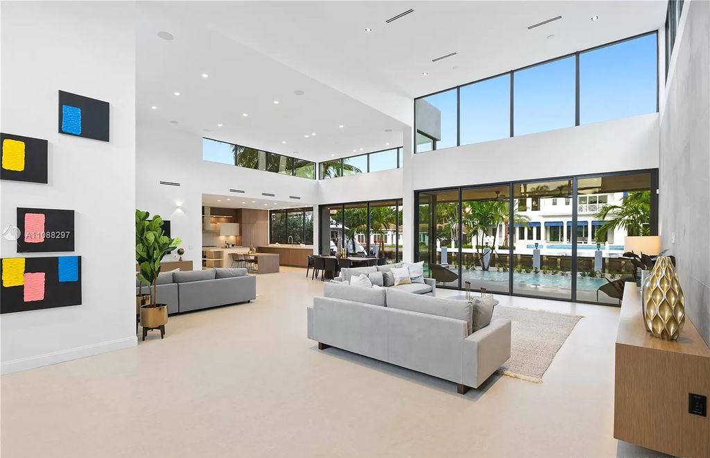 The Miami Home is a stunning brand new modern estate with enormous impact windows and doors offering an abundance of natural light now available for sale. This home located at 7362 SW 104th St, Miami, Florida