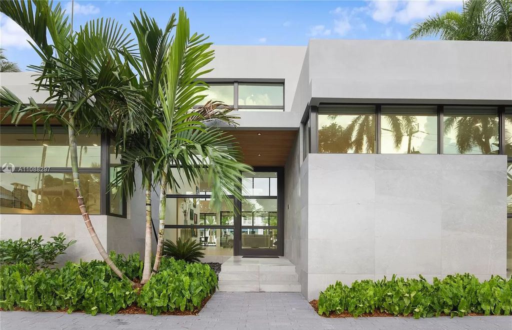 The Miami Home is a stunning brand new modern estate with enormous impact windows and doors offering an abundance of natural light now available for sale. This home located at 7362 SW 104th St, Miami, Florida