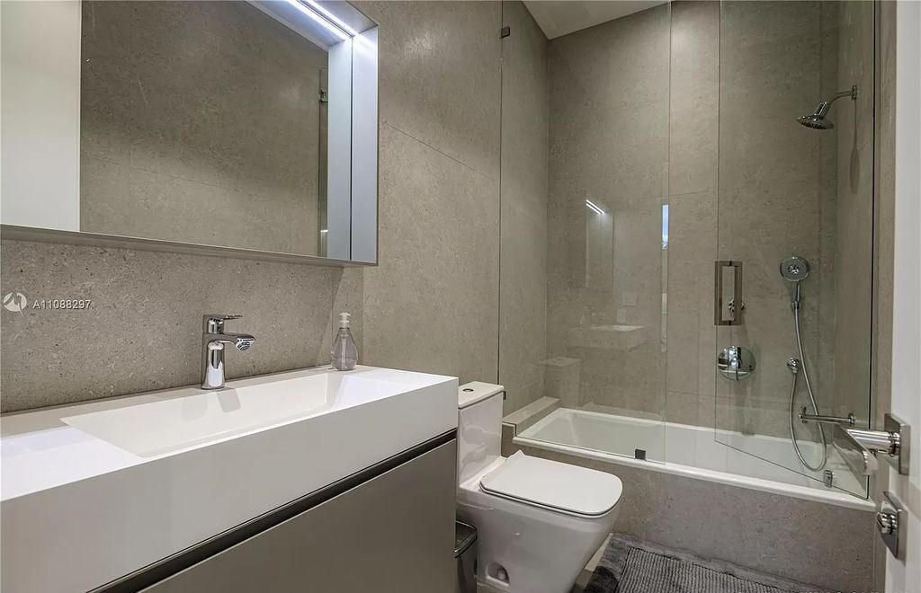 The Miami Home is a stunning brand new modern estate with enormous impact windows and doors offering an abundance of natural light now available for sale. This home located at 7362 SW 104th St, Miami, Florida