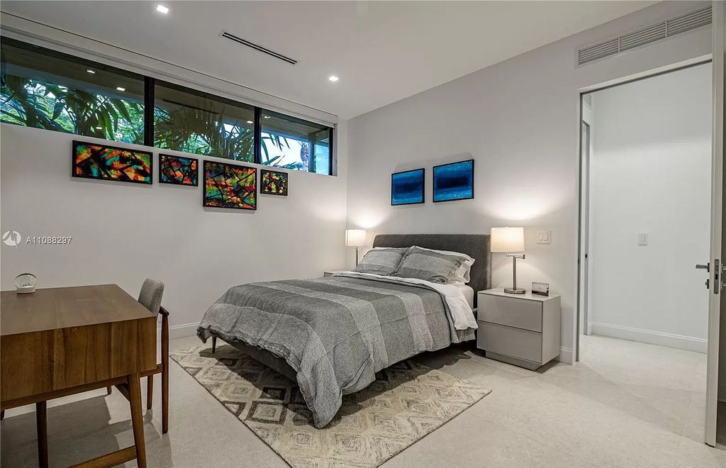 The Miami Home is a stunning brand new modern estate with enormous impact windows and doors offering an abundance of natural light now available for sale. This home located at 7362 SW 104th St, Miami, Florida