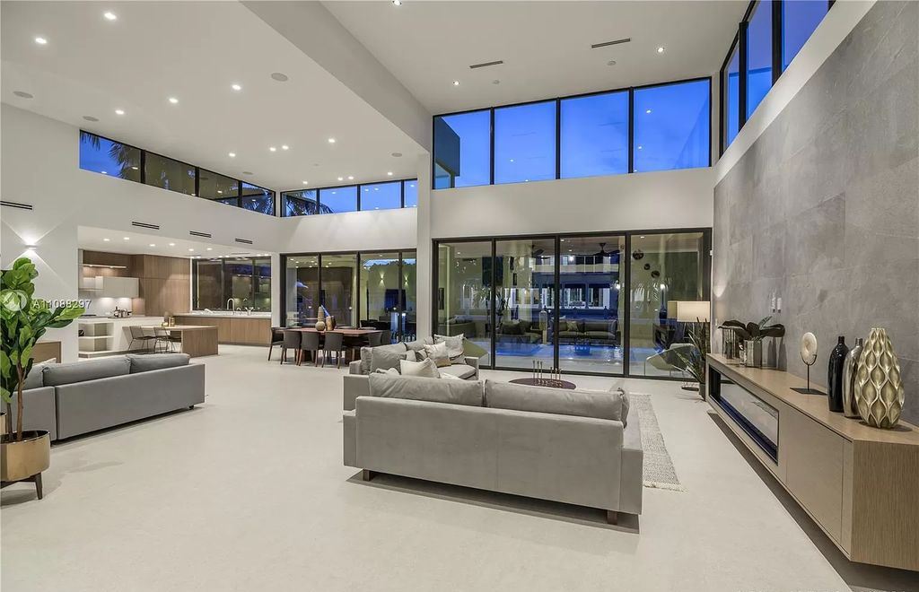 The Miami Home is a stunning brand new modern estate with enormous impact windows and doors offering an abundance of natural light now available for sale. This home located at 7362 SW 104th St, Miami, Florida
