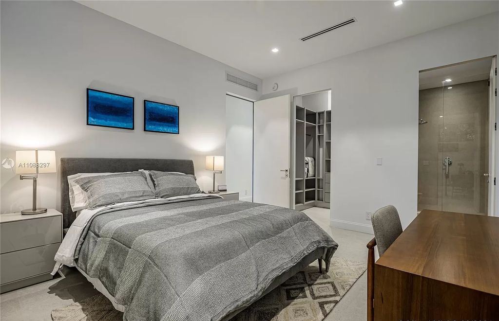 The Miami Home is a stunning brand new modern estate with enormous impact windows and doors offering an abundance of natural light now available for sale. This home located at 7362 SW 104th St, Miami, Florida