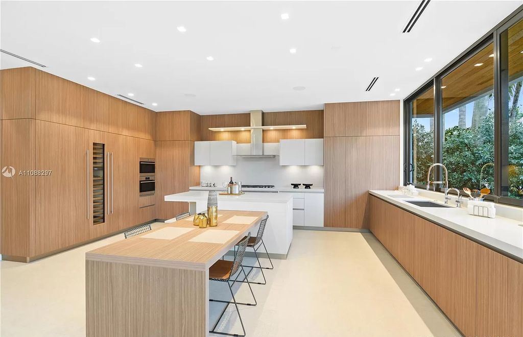 The Miami Home is a stunning brand new modern estate with enormous impact windows and doors offering an abundance of natural light now available for sale. This home located at 7362 SW 104th St, Miami, Florida