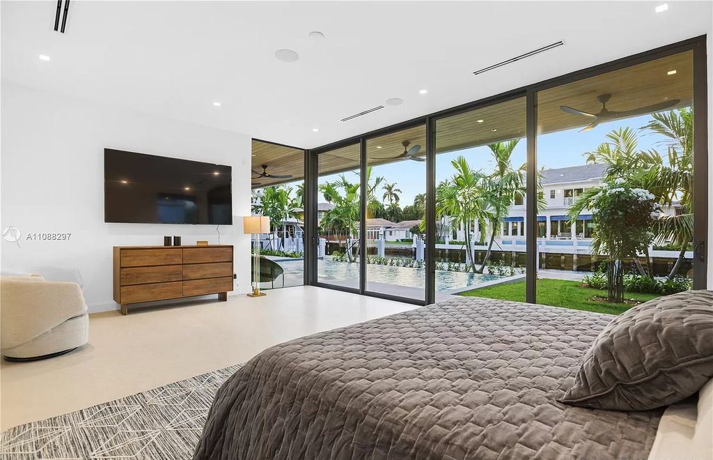 The Miami Home is a stunning brand new modern estate with enormous impact windows and doors offering an abundance of natural light now available for sale. This home located at 7362 SW 104th St, Miami, Florida