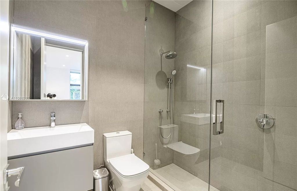 The Miami Home is a stunning brand new modern estate with enormous impact windows and doors offering an abundance of natural light now available for sale. This home located at 7362 SW 104th St, Miami, Florida