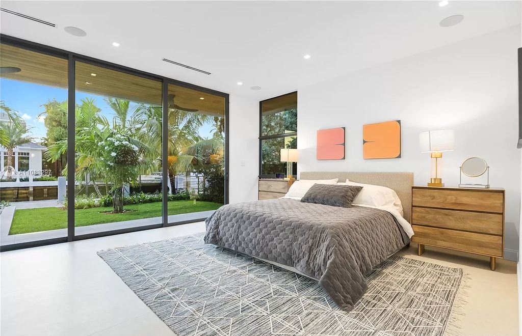 The Miami Home is a stunning brand new modern estate with enormous impact windows and doors offering an abundance of natural light now available for sale. This home located at 7362 SW 104th St, Miami, Florida