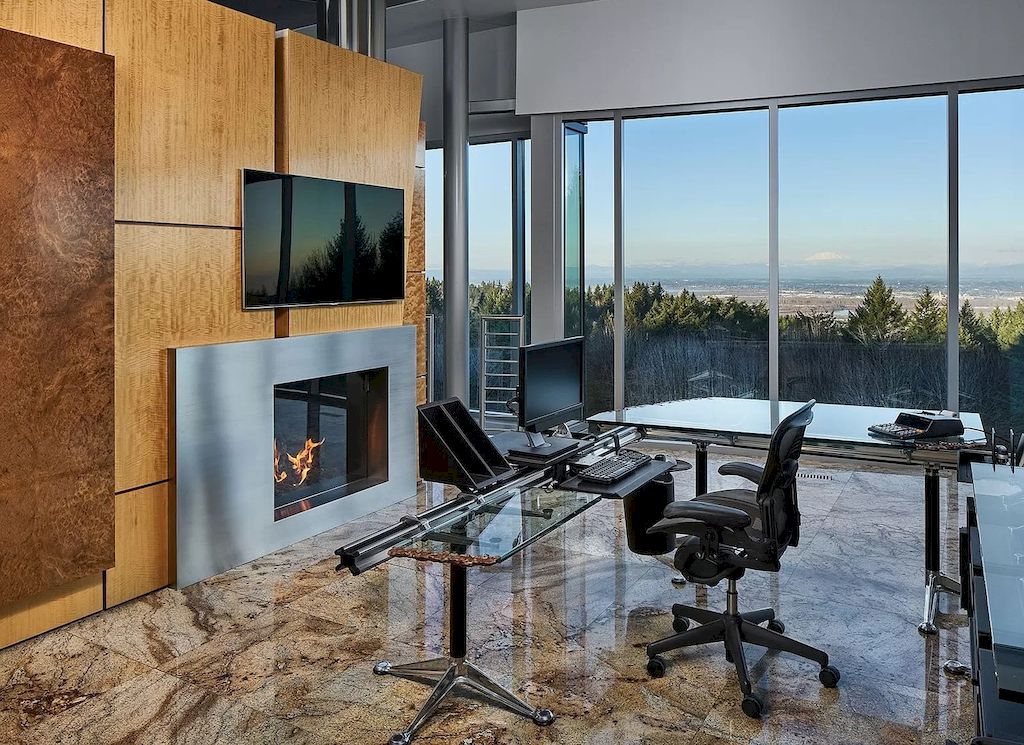 The Architecturally Significant Contemporary House in Oregon offers the perfect balance between function & form now available for sale. This home is located at 9912 NW Wind Ridge Dr, Portland, Oregon