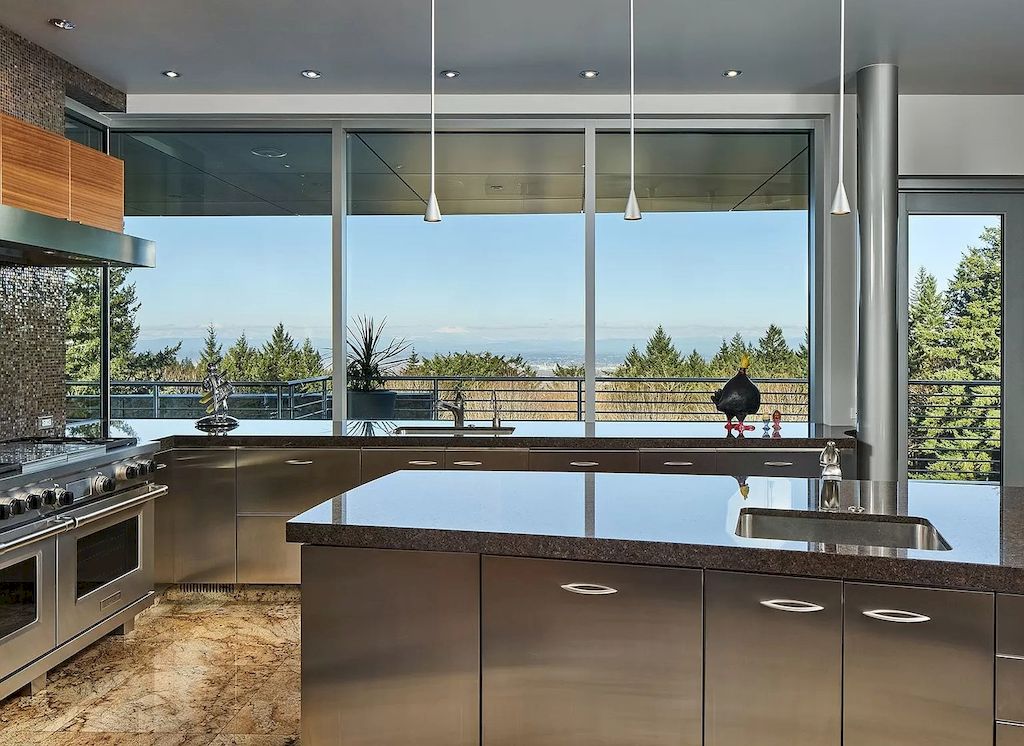 The Architecturally Significant Contemporary House in Oregon offers the perfect balance between function & form now available for sale. This home is located at 9912 NW Wind Ridge Dr, Portland, Oregon