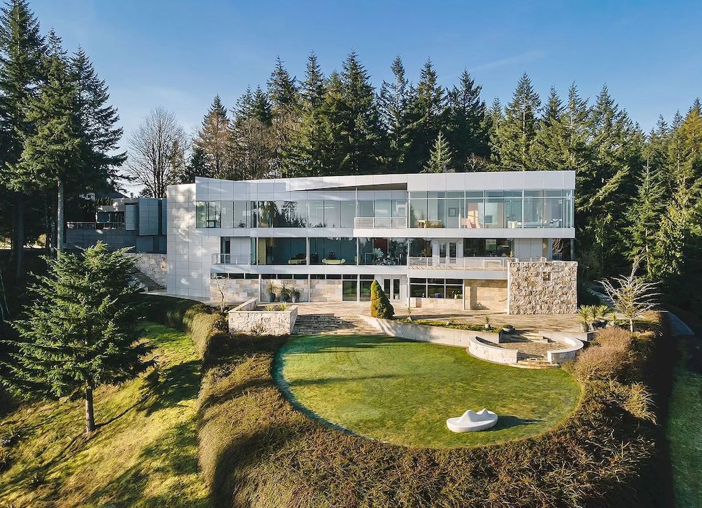 The Architecturally Significant Contemporary House in Oregon offers the perfect balance between function & form now available for sale. This home is located at 9912 NW Wind Ridge Dr, Portland, Oregon