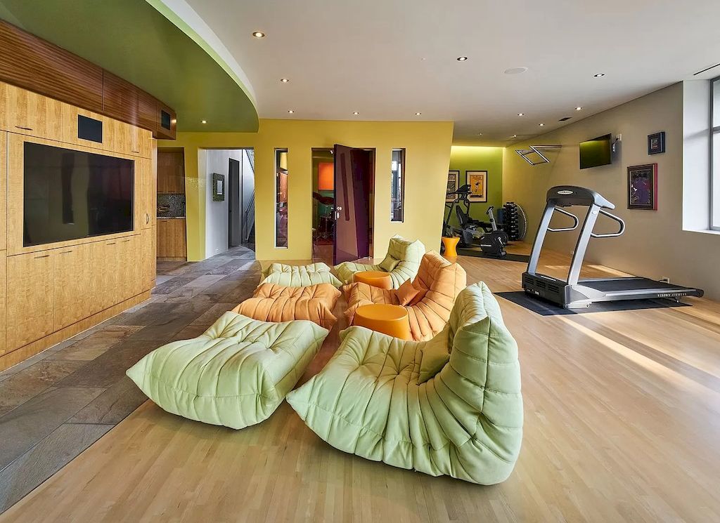 The Architecturally Significant Contemporary House in Oregon offers the perfect balance between function & form now available for sale. This home is located at 9912 NW Wind Ridge Dr, Portland, Oregon