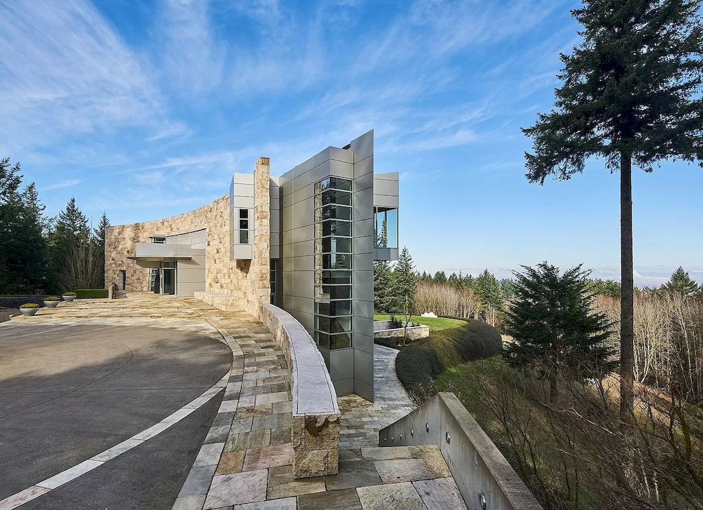 The Architecturally Significant Contemporary House in Oregon offers the perfect balance between function & form now available for sale. This home is located at 9912 NW Wind Ridge Dr, Portland, Oregon