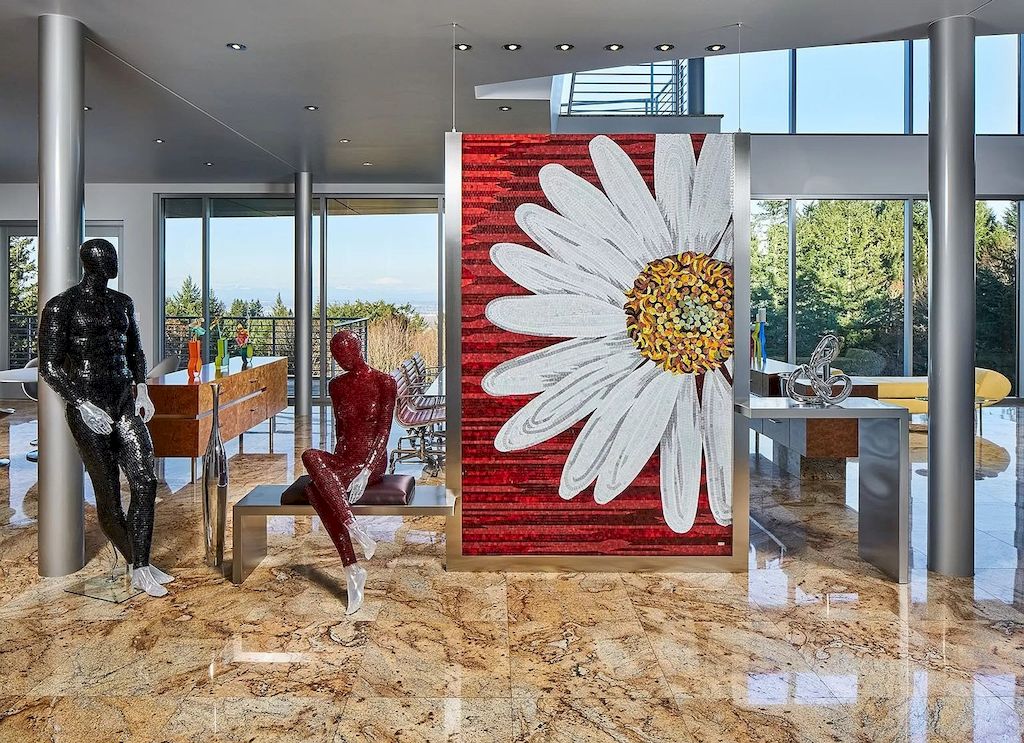 The Architecturally Significant Contemporary House in Oregon offers the perfect balance between function & form now available for sale. This home is located at 9912 NW Wind Ridge Dr, Portland, Oregon