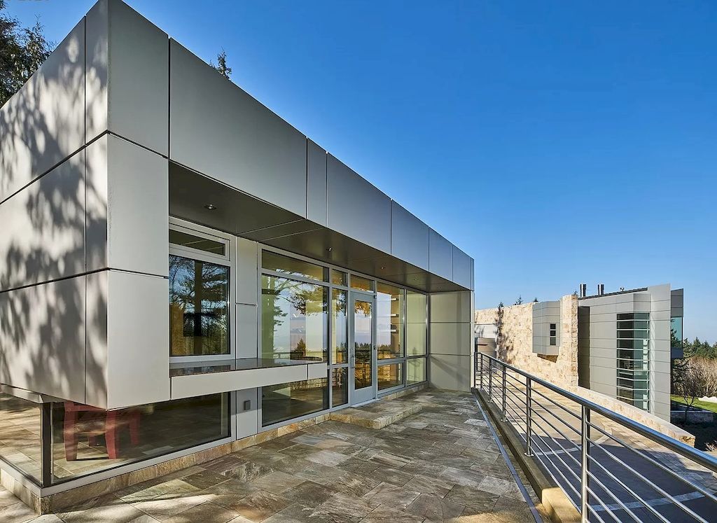 The Architecturally Significant Contemporary House in Oregon offers the perfect balance between function & form now available for sale. This home is located at 9912 NW Wind Ridge Dr, Portland, Oregon