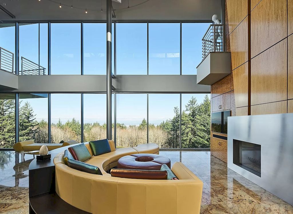 The Architecturally Significant Contemporary House in Oregon offers the perfect balance between function & form now available for sale. This home is located at 9912 NW Wind Ridge Dr, Portland, Oregon
