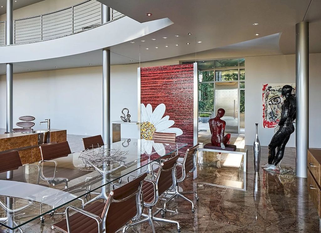 The Architecturally Significant Contemporary House in Oregon offers the perfect balance between function & form now available for sale. This home is located at 9912 NW Wind Ridge Dr, Portland, Oregon