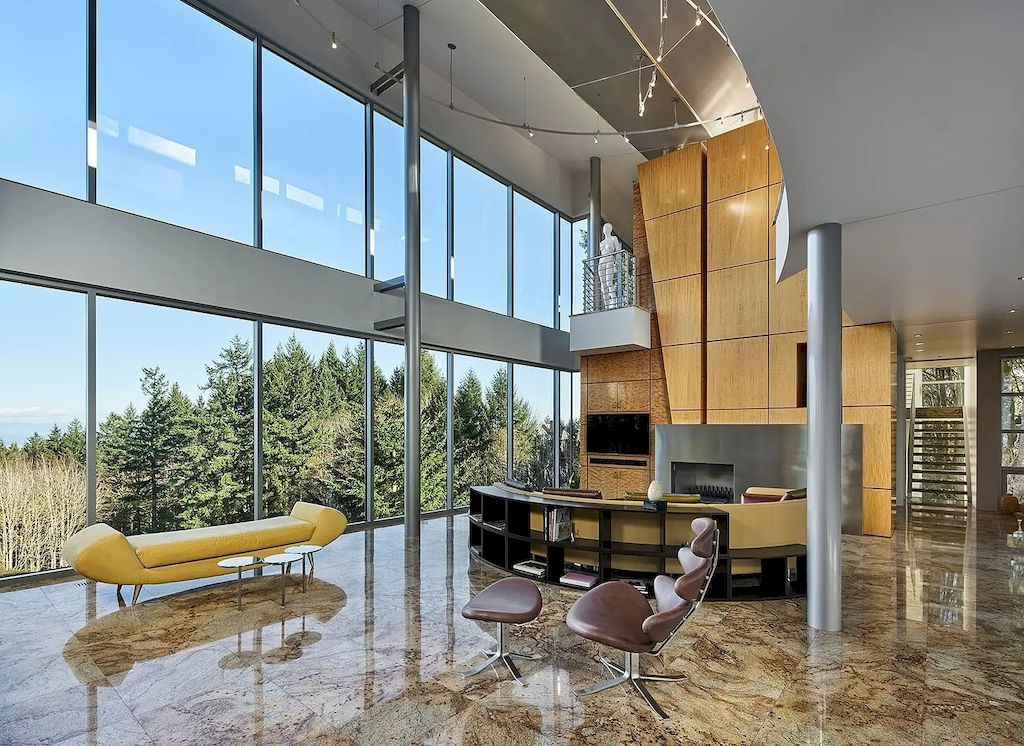 The Architecturally Significant Contemporary House in Oregon offers the perfect balance between function & form now available for sale. This home is located at 9912 NW Wind Ridge Dr, Portland, Oregon