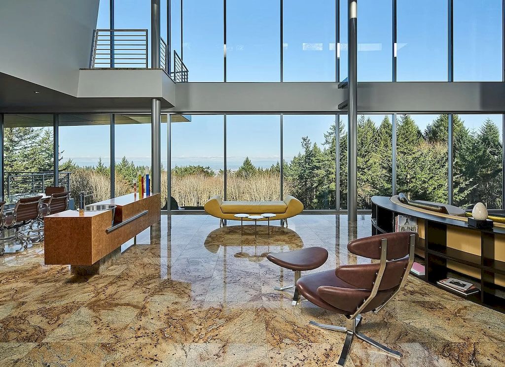 The Architecturally Significant Contemporary House in Oregon offers the perfect balance between function & form now available for sale. This home is located at 9912 NW Wind Ridge Dr, Portland, Oregon