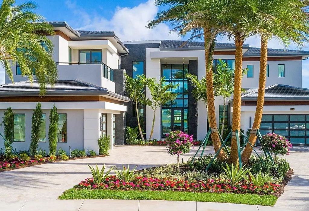 The Boca Raton Home is a Contemporary estate on a magnificent point pie lot with spectacular lake view in Boca Bridges now available for sale. This home located at 17230 Brulee Breeze Way, Boca Raton, Florida