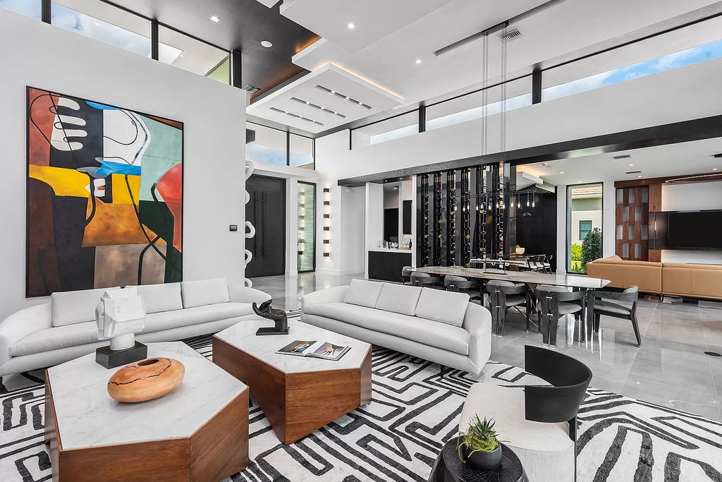 The Home in Boca Raton is a modern one story estate features a fabulous entertaining backyard with upgraded summer kitchen now available for sale. This home located at 17242 Brulee Breeze Way, Boca Raton, Florida