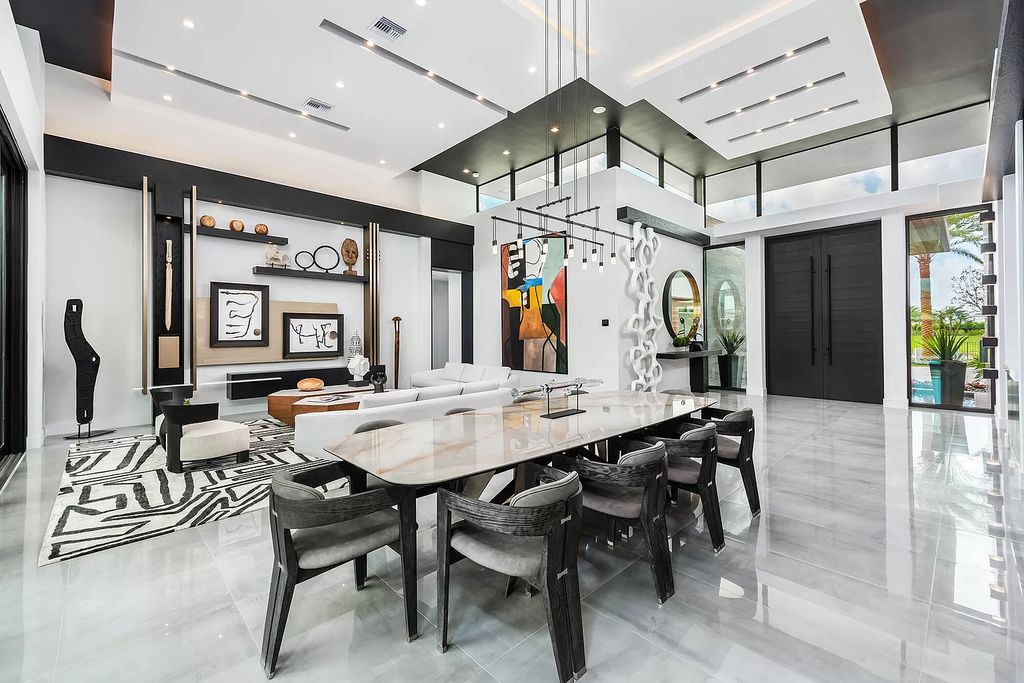 The Home in Boca Raton is a modern one story estate features a fabulous entertaining backyard with upgraded summer kitchen now available for sale. This home located at 17242 Brulee Breeze Way, Boca Raton, Florida