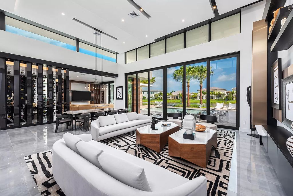 The Home in Boca Raton is a modern one story estate features a fabulous entertaining backyard with upgraded summer kitchen now available for sale. This home located at 17242 Brulee Breeze Way, Boca Raton, Florida