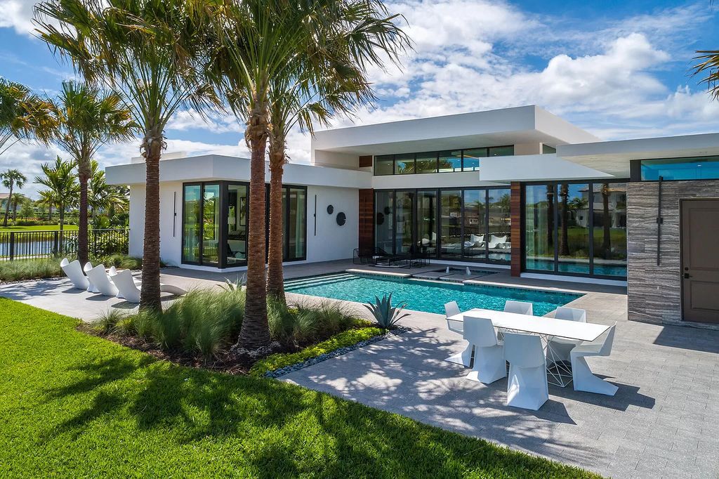 The Home in Boca Raton is a modern one story estate features a fabulous entertaining backyard with upgraded summer kitchen now available for sale. This home located at 17242 Brulee Breeze Way, Boca Raton, Florida