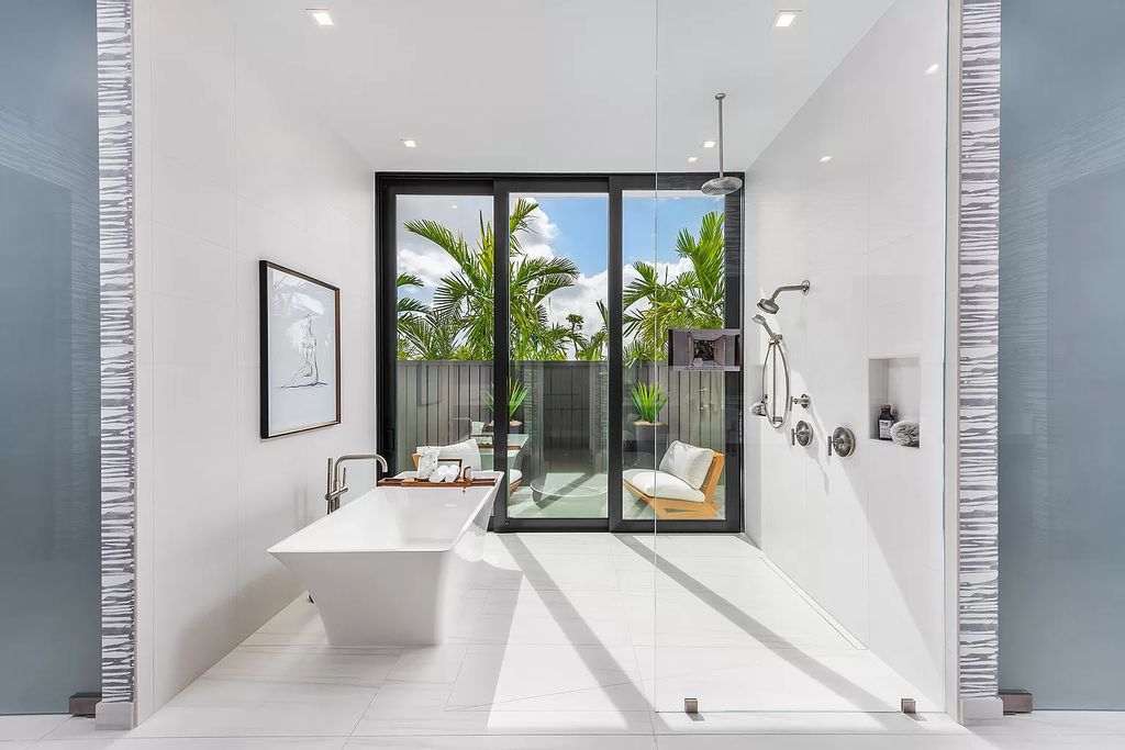 The Home in Boca Raton is a modern one story estate features a fabulous entertaining backyard with upgraded summer kitchen now available for sale. This home located at 17242 Brulee Breeze Way, Boca Raton, Florida