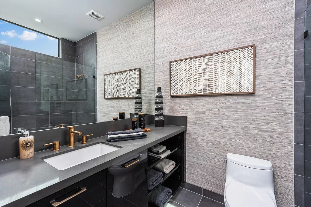 The Home in Boca Raton is a modern one story estate features a fabulous entertaining backyard with upgraded summer kitchen now available for sale. This home located at 17242 Brulee Breeze Way, Boca Raton, Florida