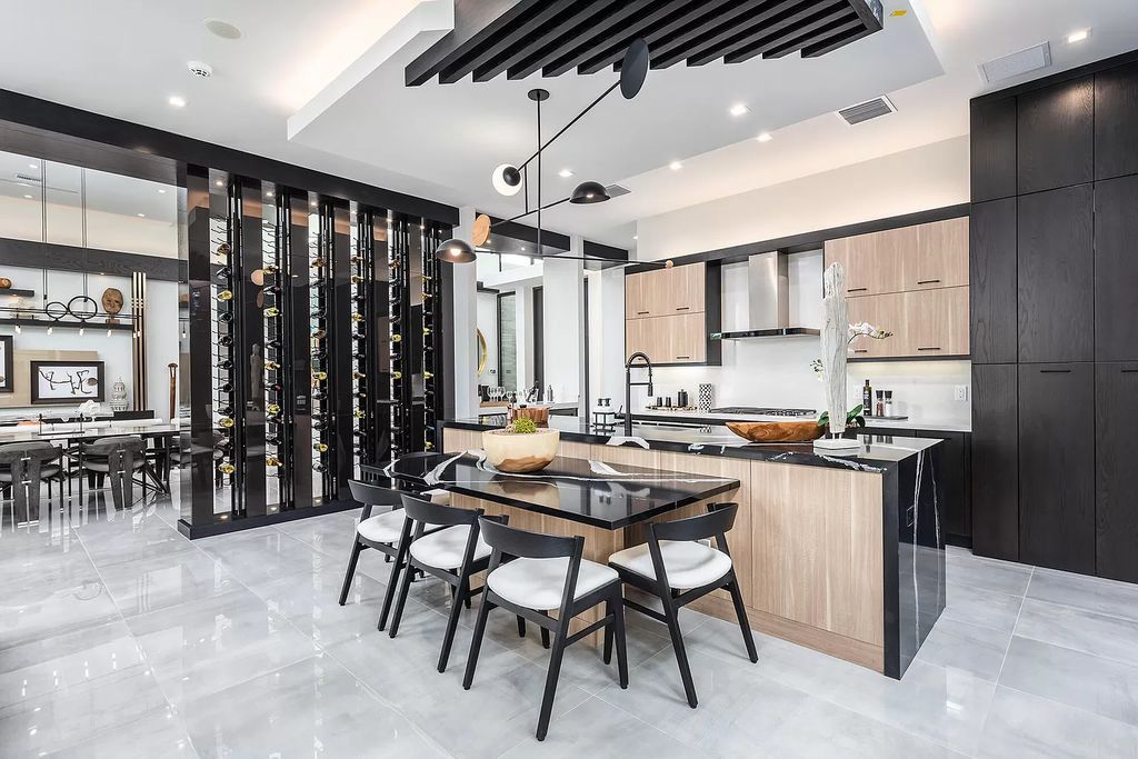 The Home in Boca Raton is a modern one story estate features a fabulous entertaining backyard with upgraded summer kitchen now available for sale. This home located at 17242 Brulee Breeze Way, Boca Raton, Florida