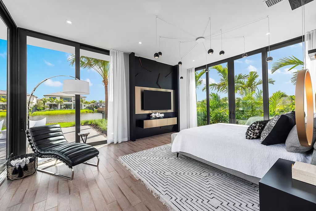 The Home in Boca Raton is a modern one story estate features a fabulous entertaining backyard with upgraded summer kitchen now available for sale. This home located at 17242 Brulee Breeze Way, Boca Raton, Florida