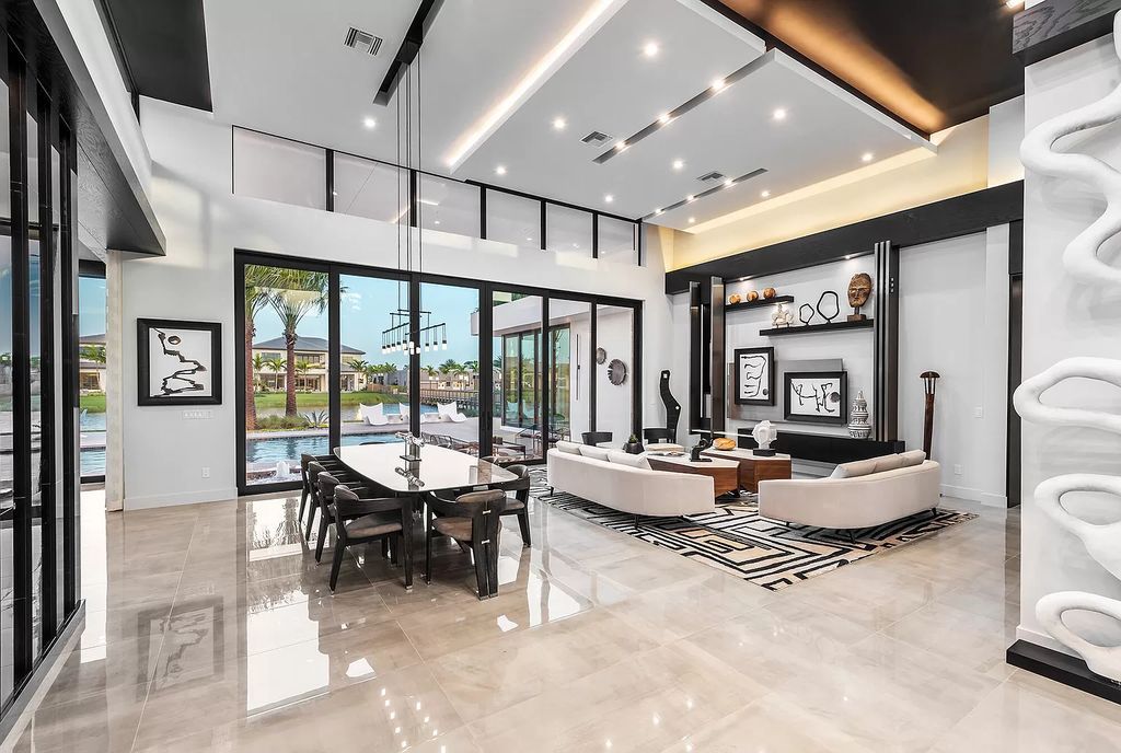The Home in Boca Raton is a modern one story estate features a fabulous entertaining backyard with upgraded summer kitchen now available for sale. This home located at 17242 Brulee Breeze Way, Boca Raton, Florida
