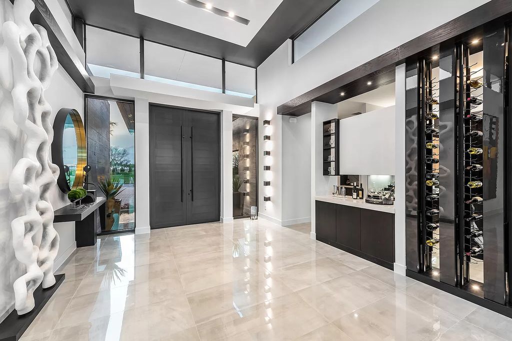 The Home in Boca Raton is a modern one story estate features a fabulous entertaining backyard with upgraded summer kitchen now available for sale. This home located at 17242 Brulee Breeze Way, Boca Raton, Florida