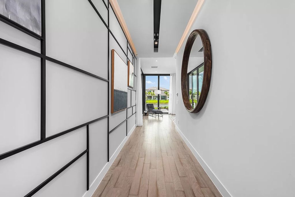 The Home in Boca Raton is a modern one story estate features a fabulous entertaining backyard with upgraded summer kitchen now available for sale. This home located at 17242 Brulee Breeze Way, Boca Raton, Florida