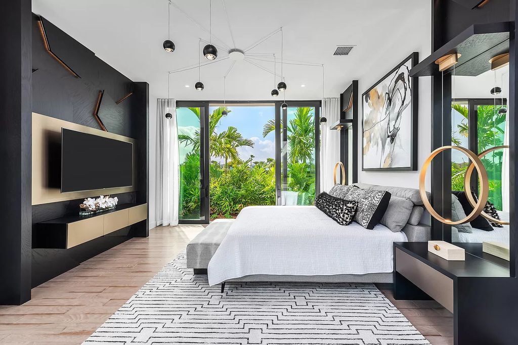The Home in Boca Raton is a modern one story estate features a fabulous entertaining backyard with upgraded summer kitchen now available for sale. This home located at 17242 Brulee Breeze Way, Boca Raton, Florida