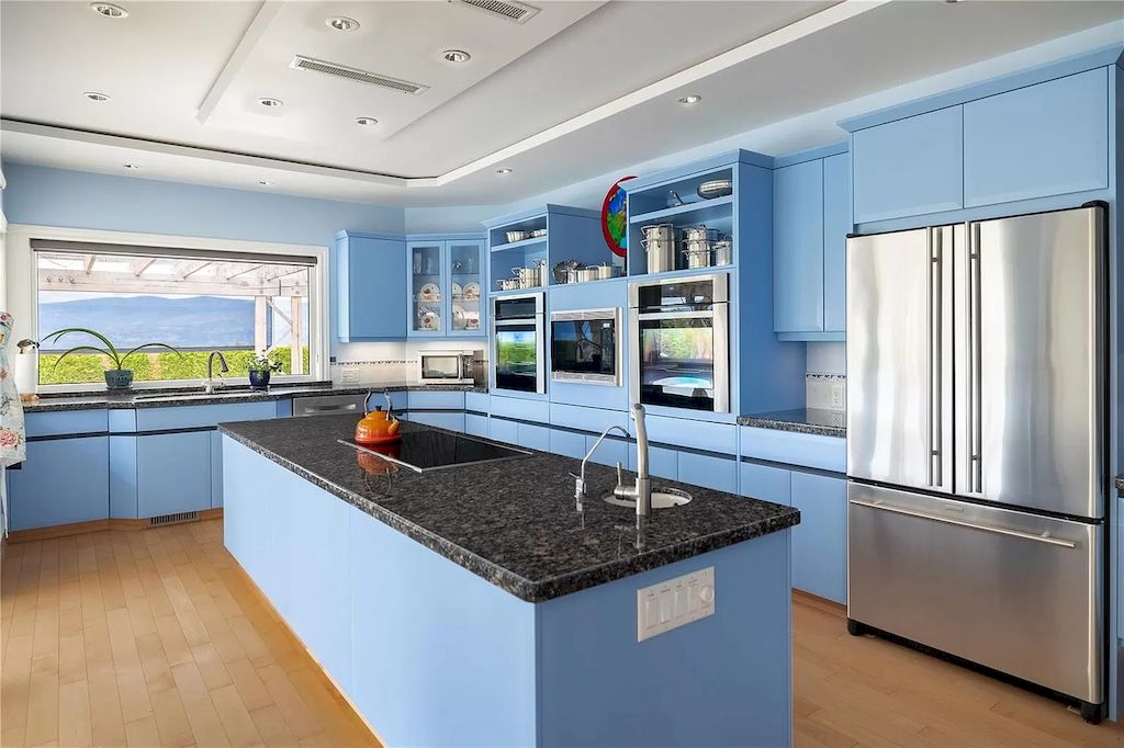 The Charming Italian Style Villa in Kelowna is a private country estate now available for sale. This home is located at 3240 Pooley Rd, Kelowna, BC V1W 4G7, Canada