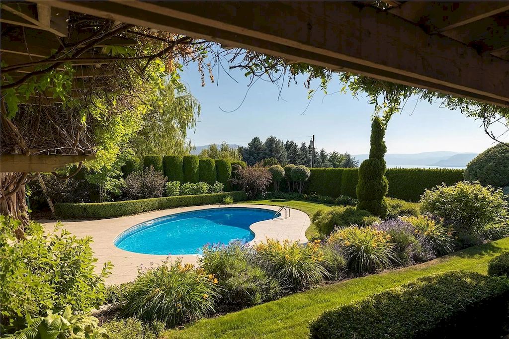 The Charming Italian Style Villa in Kelowna is a private country estate now available for sale. This home is located at 3240 Pooley Rd, Kelowna, BC V1W 4G7, Canada
