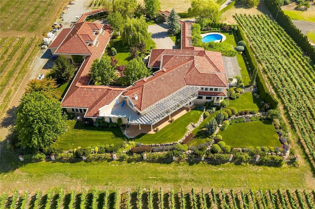 The Charming Italian Style Villa in Kelowna is a private country estate now available for sale. This home is located at 3240 Pooley Rd, Kelowna, BC V1W 4G7, Canada