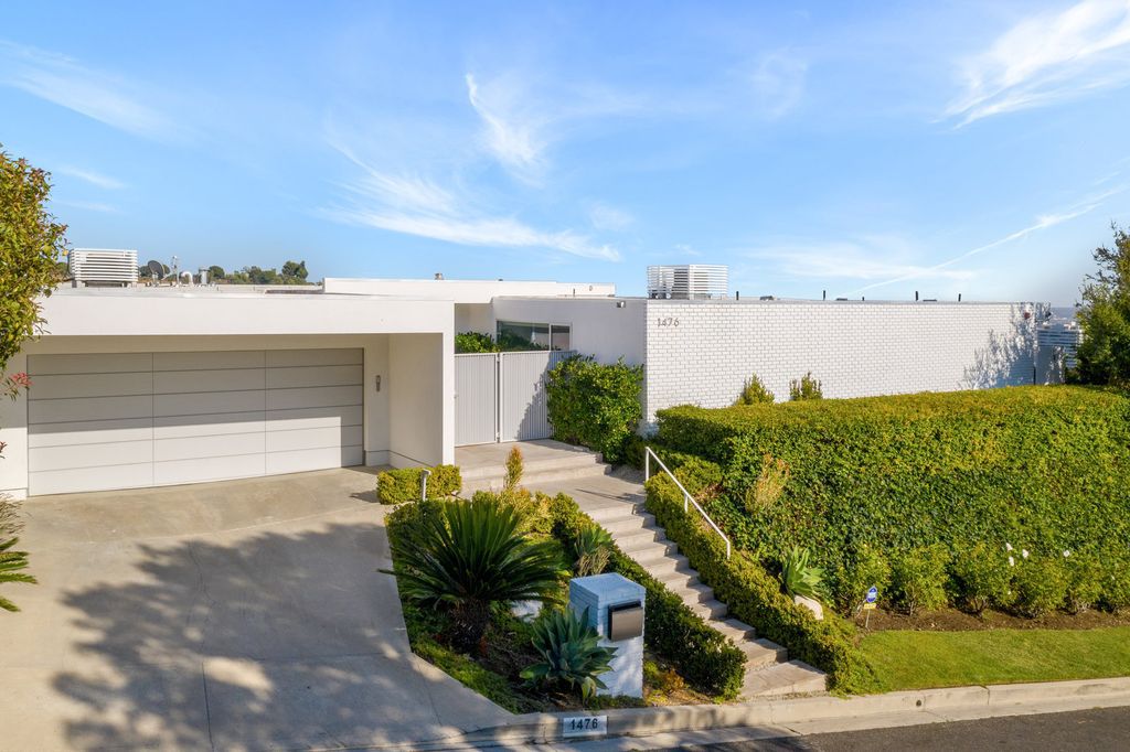 The Home in Beverly Hills is a totally remodeled and updated contemporary estate with head on city to ocean views now available for sale. This home located at 1476 Carla Rdg, Beverly Hills, California
