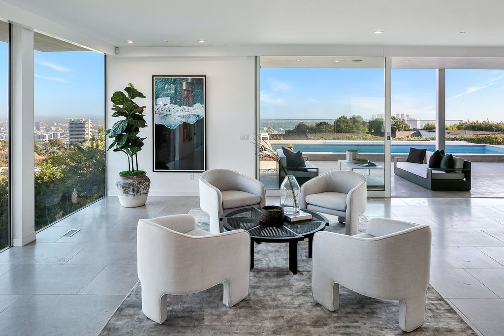 The Home in Beverly Hills is a totally remodeled and updated contemporary estate with head on city to ocean views now available for sale. This home located at 1476 Carla Rdg, Beverly Hills, California