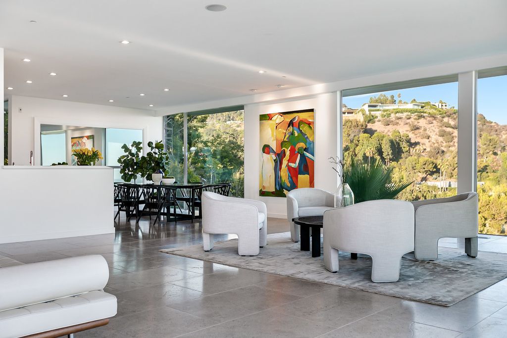 The Home in Beverly Hills is a totally remodeled and updated contemporary estate with head on city to ocean views now available for sale. This home located at 1476 Carla Rdg, Beverly Hills, California