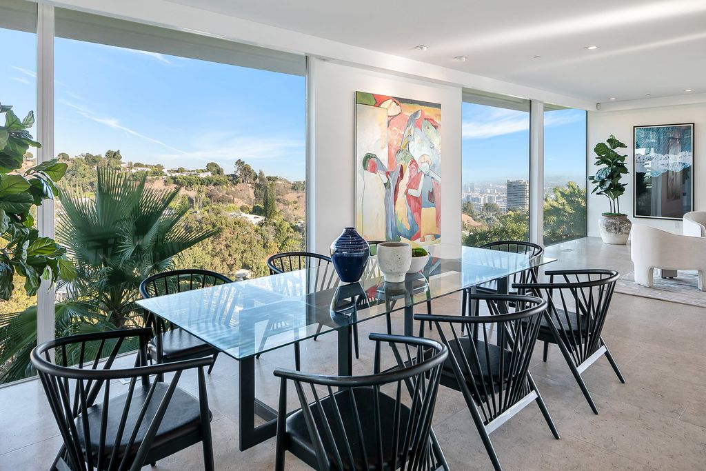 The Home in Beverly Hills is a totally remodeled and updated contemporary estate with head on city to ocean views now available for sale. This home located at 1476 Carla Rdg, Beverly Hills, California