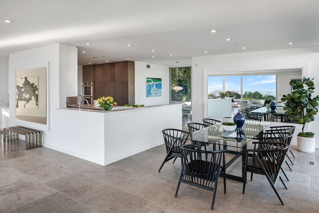 The Home in Beverly Hills is a totally remodeled and updated contemporary estate with head on city to ocean views now available for sale. This home located at 1476 Carla Rdg, Beverly Hills, California